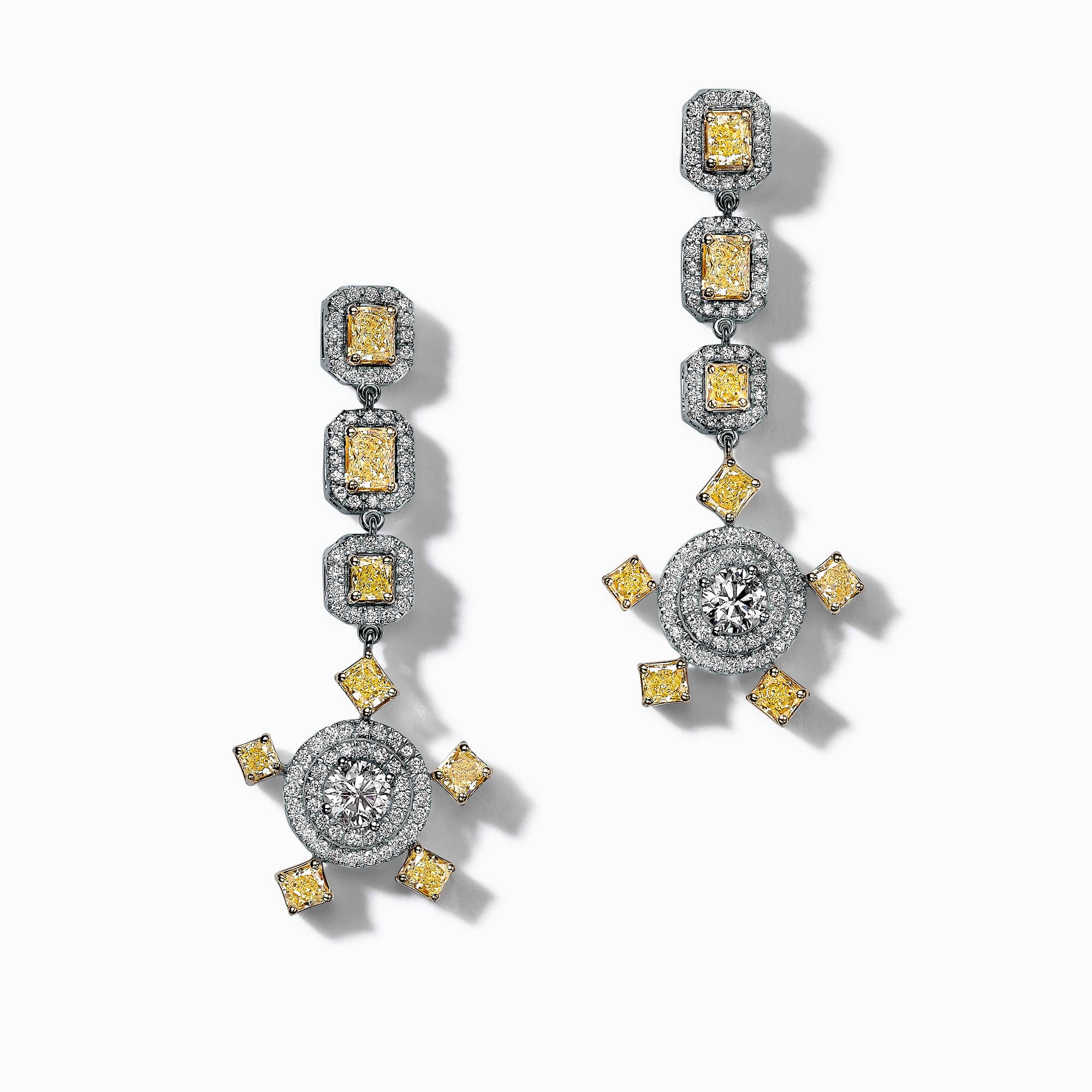 1.00Ct. I VS1 (0.50Ct. each) 2.40Ct. Fancy Yellow Diamonds