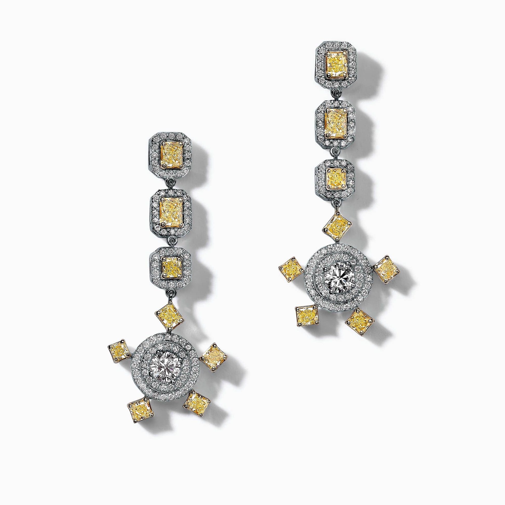 1.00Ct. I VS1 (0.50Ct. each) 2.40Ct. Fancy Yellow Diamonds