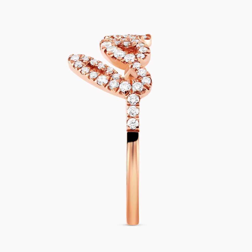 0.21Ct. Diamonds mounted in a 14K Rose Gold Love designed Ring
