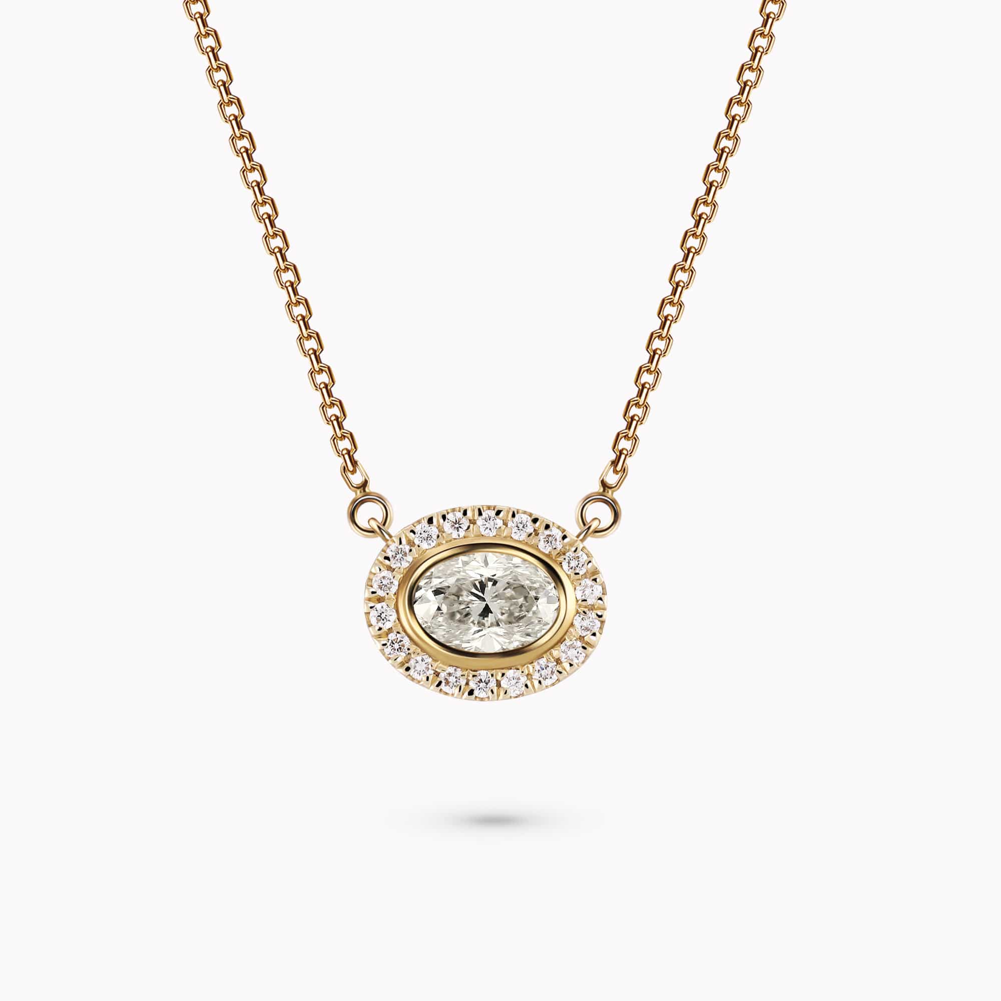 0.57Ct. Oval Cut center Diamond with 0.20Ct. Diamond Halo