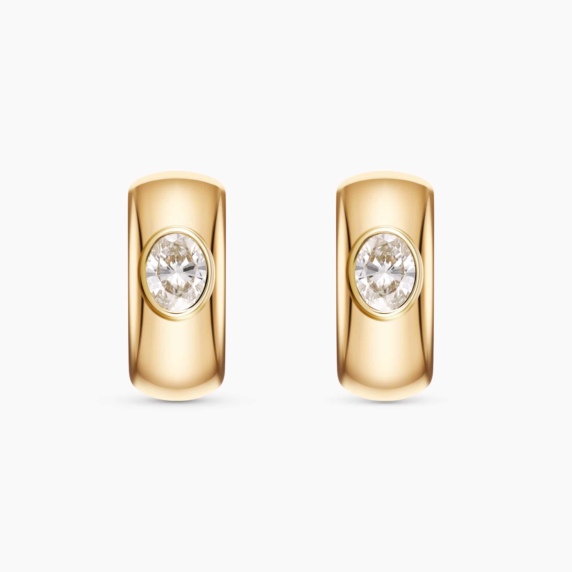 0.56Ct. Oval cut center Diamonds set in 14K Yellow Gold Earrings