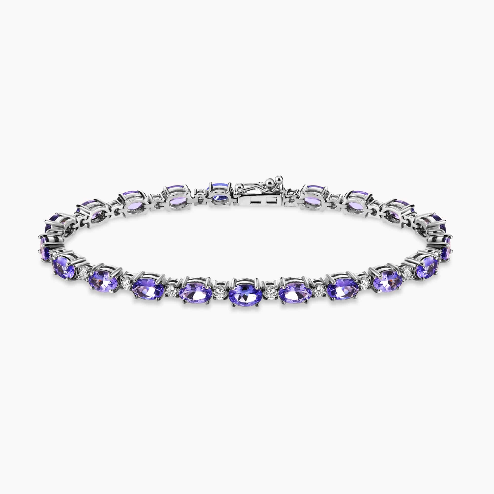 9.40Ct. Tanzanite stones set with 1.21Ct. Diamonds in a 14K