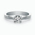 A ring, 14K gold, set with a center round cut diamond